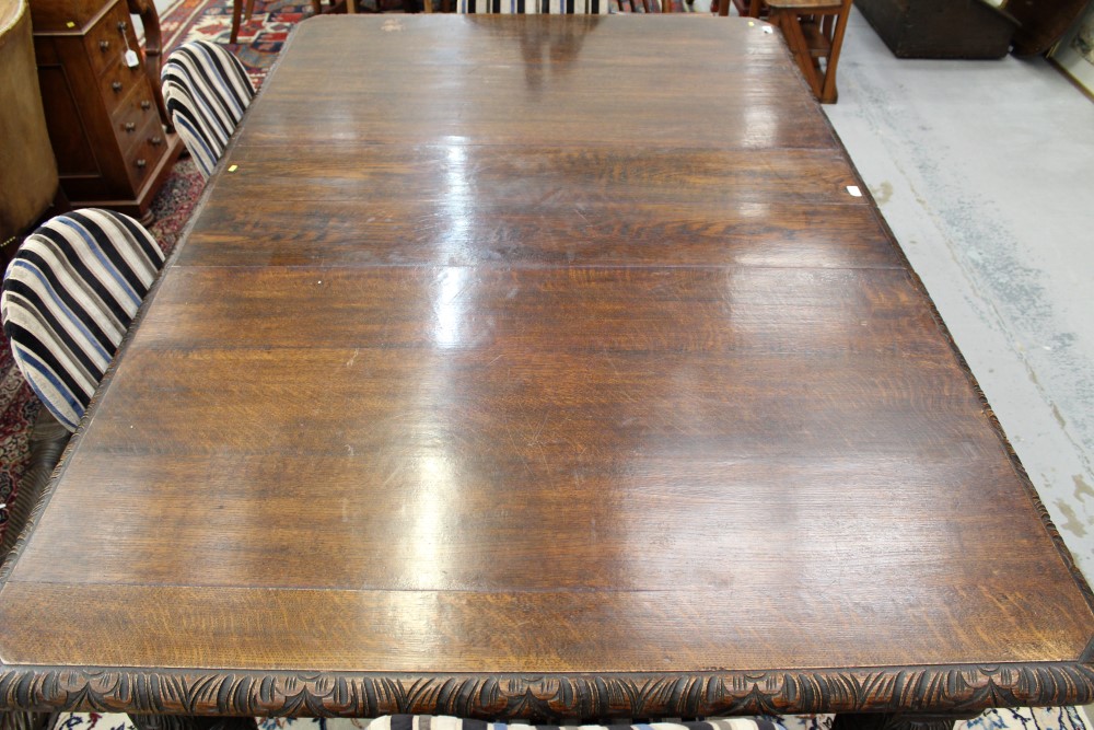 Victorian carved oak extending dining table, the rounded rectangular top with acanthus carved edge, - Image 4 of 4