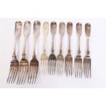 Nine Georgian and Victorian silver fiddle pattern dining forks with engraved Noon family crest