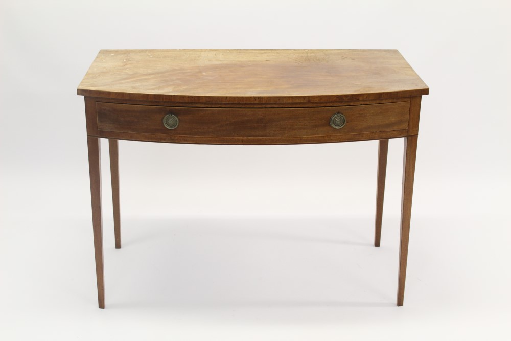 Regency mahogany bow front side table with single drawer, raised on square tapered legs,