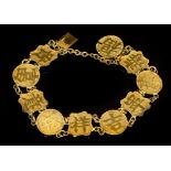 Antique Chinese yellow metal bracelet with ten panels, each with a Chinese character,
