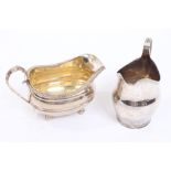 George III silver cream jug of helmet form, with vacant cartouche,