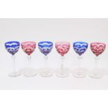 Six 1930s Bohemian blue and red overlaid hock glasses with star and slice cut decoration,