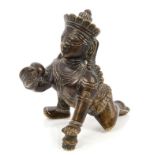 Antique bronze figure of Bala Krishna - typical crawling pose, holding a stolen butter ball,