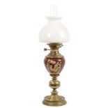 Good 19th century pottery and brass mounted oil lamp with shaped milk glass shade,