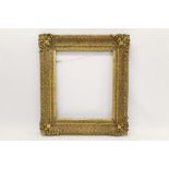 19th century gilt gesso frame - swept form, with C-scroll ornament shell corners,