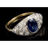Sapphire and diamond ring with an oval mixed cut blue sapphire measuring approximately 7.75mm x 6.