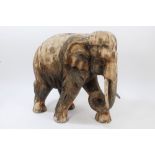 Very large Eastern carved wooden figure of an elephant, traces of pigment,