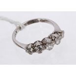 Diamond five-stone ring with five graduated old cut diamonds in platinum claw setting,