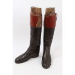 Pair of gentlemen's black leather hunting boots with brown tops and wooden trees, by Peal & Co.