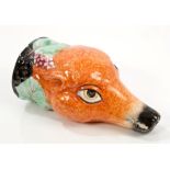 19th century French porcelain fox mask stirrup cup with moulded vine border and realistic colouring,