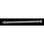 Edwardian diamond and pearl bracelet with a lattice openwork band of seed pearls on a diamond clasp