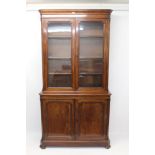 Victorian mahogany two-height bookcase with canted cornice and adjustable shelves,