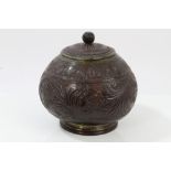 19th century Eastern carved coconut pot and cover with brass mounts and scrolling relief carved