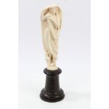 Late 19th century Continental carved ivory figure depicting a semi-clad female,