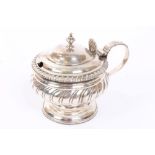 George IV silver mustard pot of circular form, with gadrooned decoration and borders,