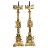 Impressive pair of Gothic pierced brass floor-standing pricket candlesticks with hexagonal