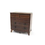 Regency mahogany crossbanded miniature chest of drawers with two short over three graduated drawers,