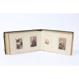 A Victorian photograph album containing carte de visite portrait photographs of celebrities and