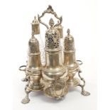 George III silver cruet stand of cinque-lobed form,