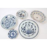 Two 18th century Delft blue and white tin glazed chargers with floral decoration, 30cm x 34cm,