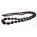 Vintage simulated cherry amber graduated bead necklace, graduating from approximately 27mm - 12mm,