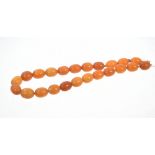 Old amber necklace with a string of butterscotch amber beads measuring approximately 15mm - 17mm,