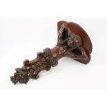 19th century carved oak wall bracket with shaped shelf,