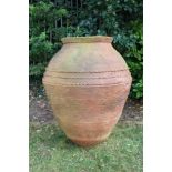 Massive terracotta garden urn of swollen form, with everted rim and bands of ornament,