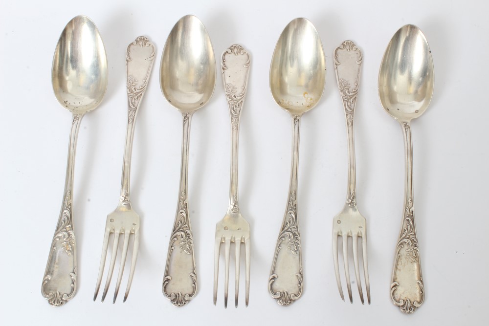 Four late 19th / early 20th century French silver tablespoons with foliate decorated stems and