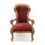 Victorian walnut spoon back open armchair with ruby button-upholstered and carved show-wood frame,