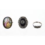 Antique dress ring with a polychrome painted porcelain panel depicting an 18th century lady playing