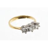 Diamond three stone ring with three brilliant cut diamonds in claw setting, on 18ct gold shank.