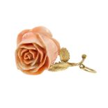 Carved pink coral pendant in the form of a rose, the carved coral rose with gold leaves and stem,