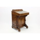 Mid-Victorian walnut davenport with rear stationery compartment and tooled leather inset writing