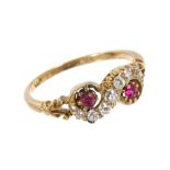 Late Victorian ruby and diamond crossover ring with two rubies and old cut diamonds in a crossover