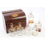 George III inlaid mahogany bureau-shaped decanter box with boxwood paterae rising lid,