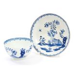 18th century Lowestoft blue and white tea bowl and saucer with painted floral,