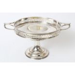 George V silver comport of circular form, with pierced border and twin Art Nouveau-style handles,