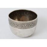 Late 19th century Indian or Burmese white metal bowl of circular form,