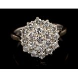 Diamond cluster ring with a circular cluster of nineteen brilliant cut diamonds in tiered claw
