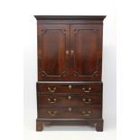 George III mahogany linen press of diminutive proportions,