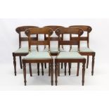 Set of five Regency mahogany dining chairs, each with rosette carved top rail and reeded bar back,