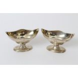 Pair George III silver salts of boat-shaped form, with traces of engraved initials,