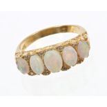Victorian-style opal and diamond ring with five opal cabochons with diamond accents to the claws,