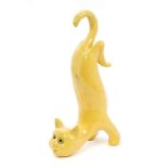 Early 20th century Mosanic-type yellow glazed comical cat with glass eyes, circa 1900,