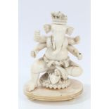 Late 19th / early 20th century Indian carved ivory figure of Ganesh seated on lotus flower base,