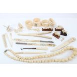 Group of antique ivory and carved bone items - to include 1920s carved ivory animals,