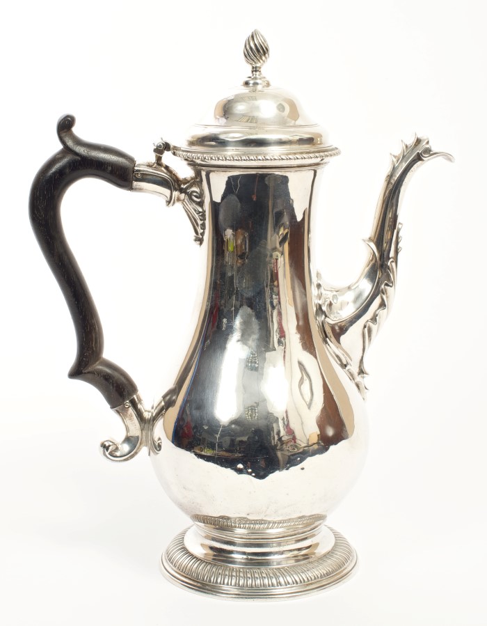 George III silver coffee pot of baluster form, with ornate spout,