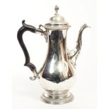 George III silver coffee pot of baluster form, with ornate spout,