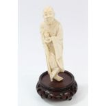Late 19th / early 20th century Japanese carved ivory figure of a sage holding gourd and standing on